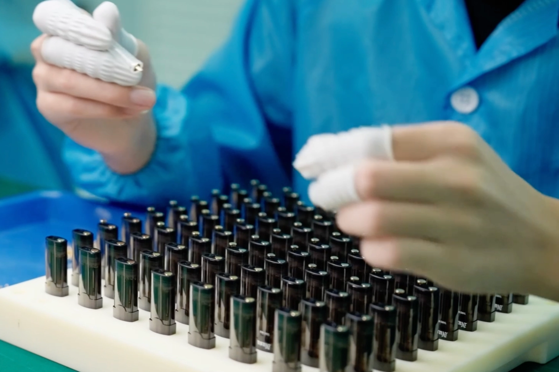 Quality control staff inspecting disposable vapes at Vaporeur manufacturing plant